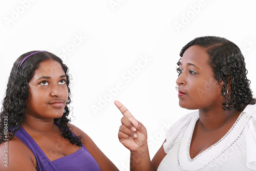 mother warn her daughter for bad behavior, isolated on white
