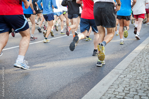 People running in city marathon on street © Rafal Olechowski