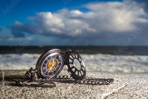 Pocket watch on the beach