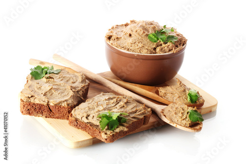 Fresh pate with bread on wooden board isolated on white photo