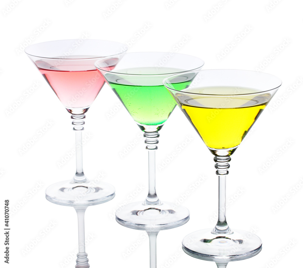 alcoholic cocktails on table isolated on white