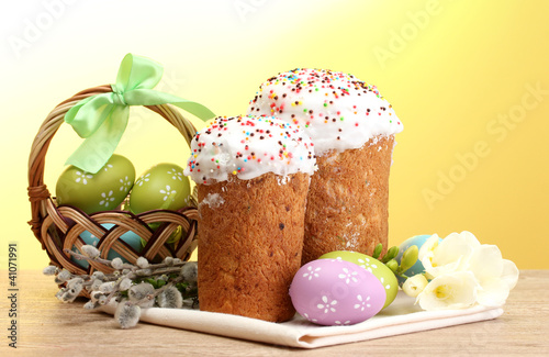 Beautiful Easter cakes, colorful eggs in basket and