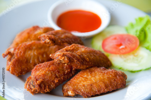deep fried spicy chicken wing with chili sauce