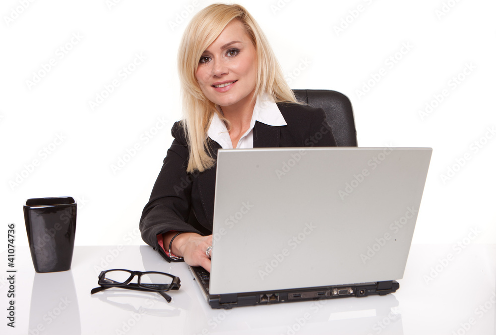 Efficient businesswoman working on her laptop Efficient businesswoman working on her laptop