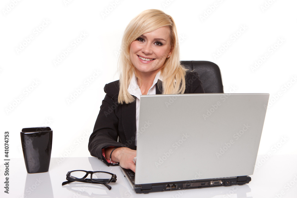 Efficient businesswoman working on her laptop Efficient businesswoman working on her laptop