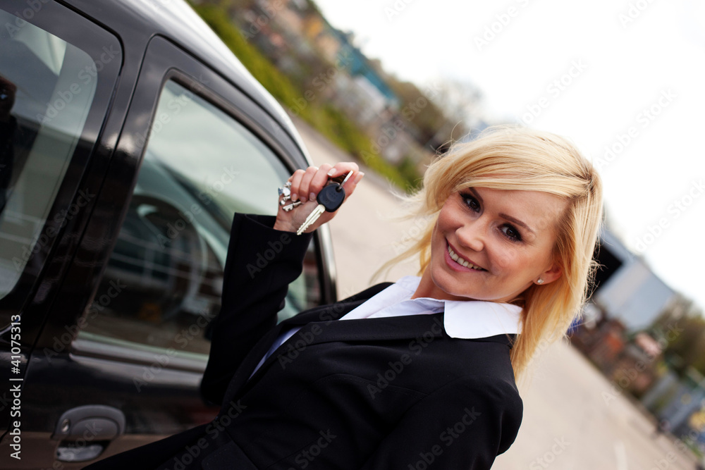 Smiling blonde with car keys