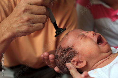shaving hair of new born infant when one month aged