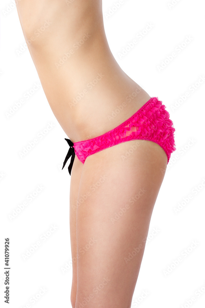 Fit body of beautiful young woman in pink sexy panties