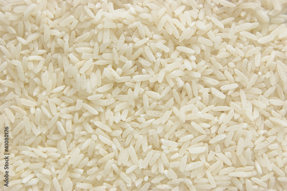 White long rice background, uncooked raw cereals, macro closeup White long rice background, uncooked raw cereals, macro closeup