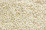 White long rice background, uncooked raw cereals, macro closeup
