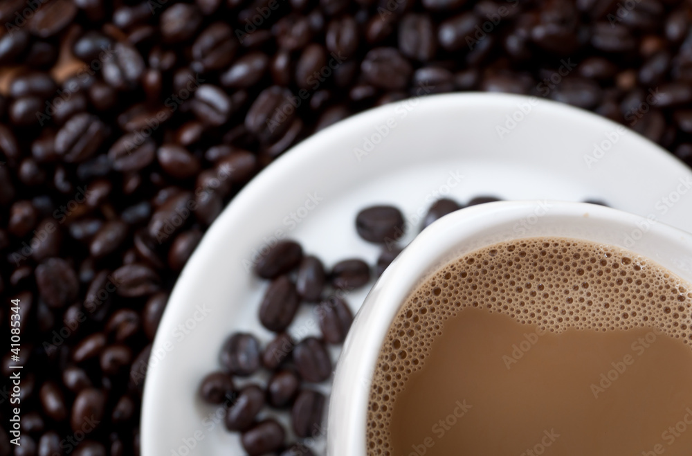 Obraz premium coffee beans with white coffee cup .