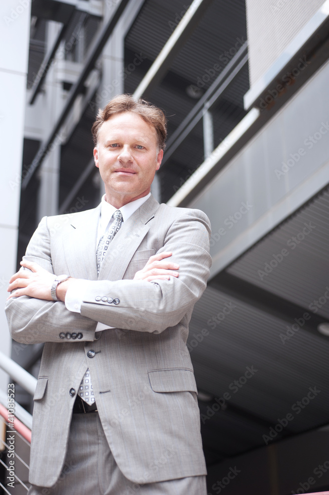 Fototapeta premium portrait of a confident mature businessman standing outside