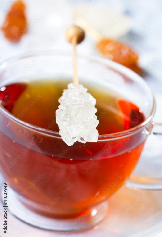 Cup of tea with sugar stick Cup of tea with sugar stick