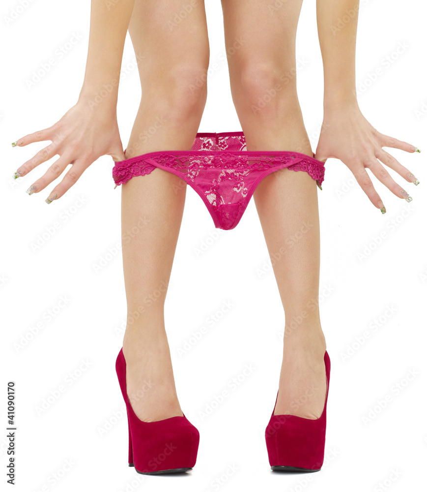 Woman taking off her panties Stock Photo