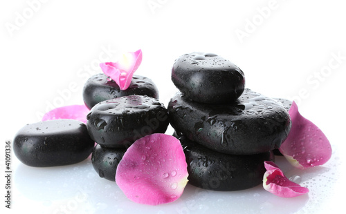 Spa stones with drops and rose petals isolated on white