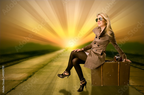 Fototapeta Naklejka Na Ścianę i Meble -  Beautiful blond woman waiting on train, concept of travel