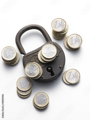 old padlock with coins euro - vecchio lucchetto con euro photo