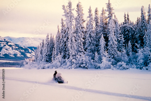 Winter snow sports on a snowmobile photo