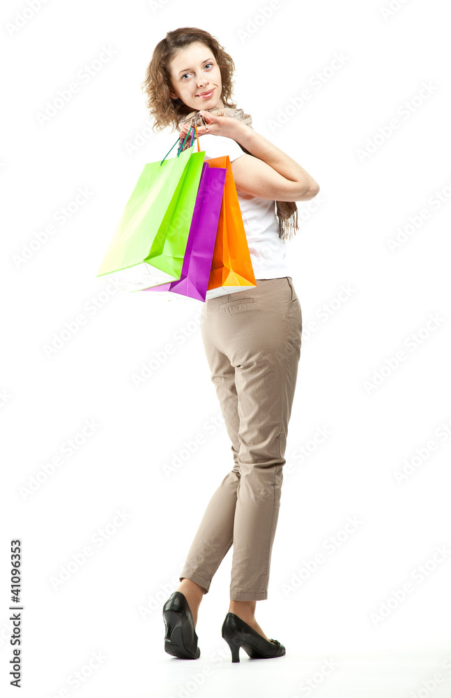 Smiling young woman holding shopping bags Smiling young woman holding shopping bags