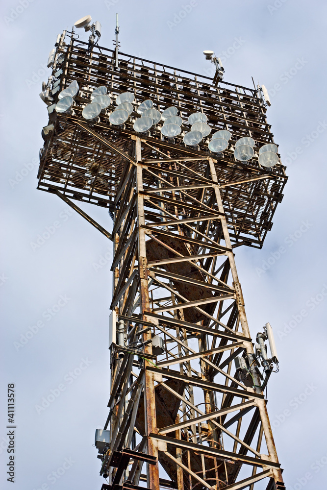 Light projectors on old rust metal tower
