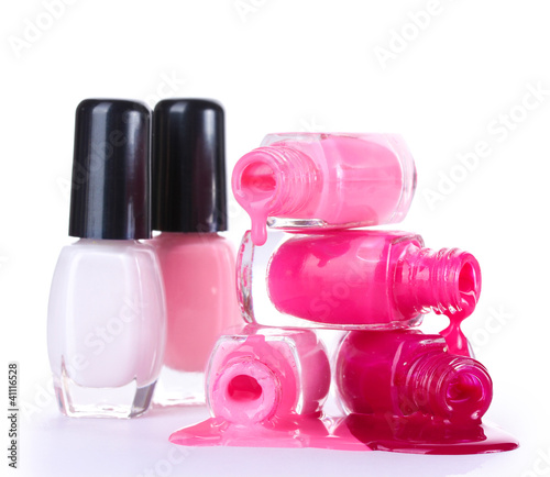 open bottles with bright nail polish isolated on white