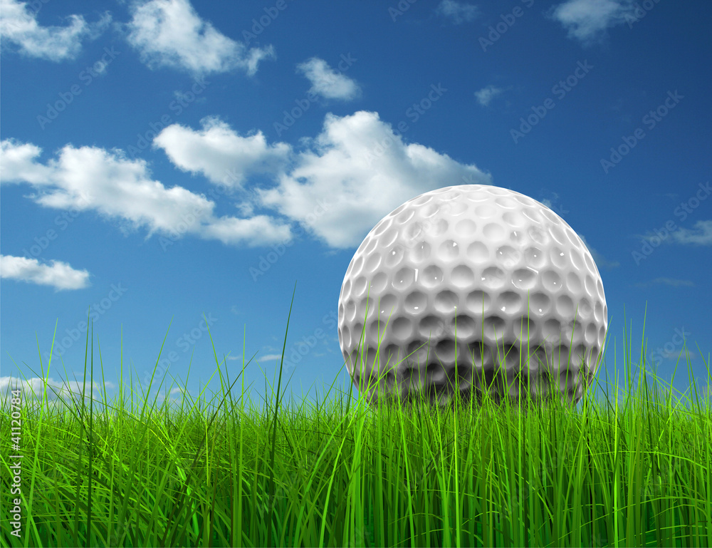 Conceptual golf ball in grass over a blue sky Conceptual golf ball in grass over a blue sky