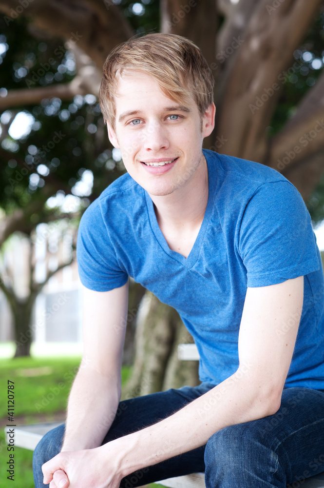 portrait of a young male in a park portrait of a young male in a park