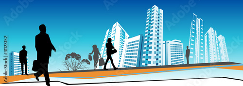 Business people walking in front of skyscrapers