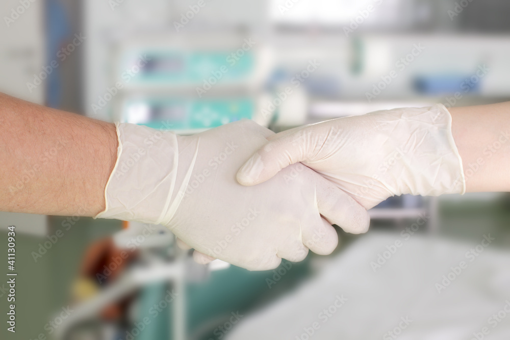 handshake in the hospital. Greeting two medical workers. handshake in the hospital. Greeting two medical workers.