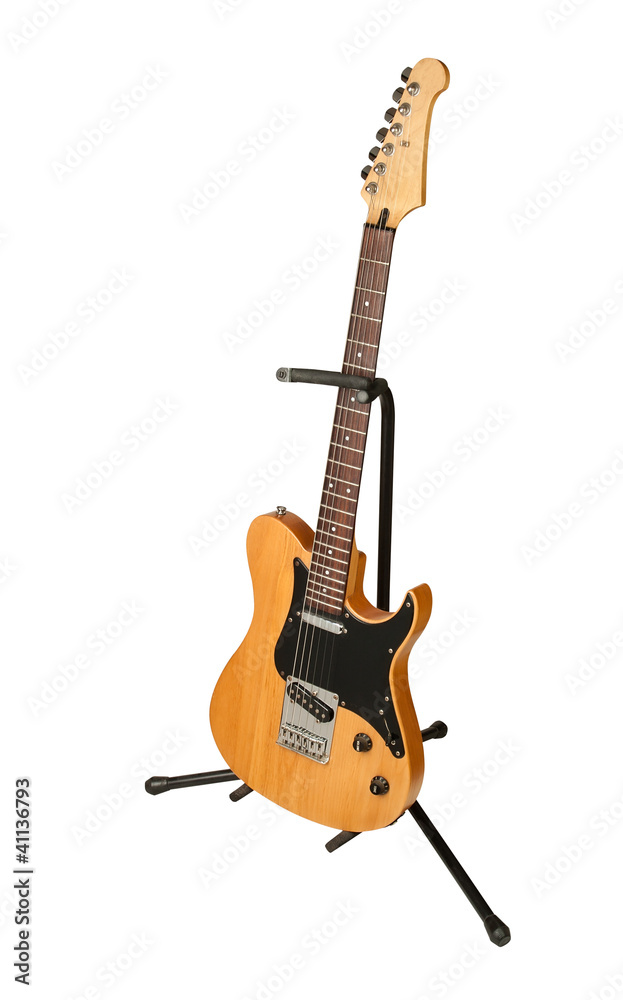 Fototapeta premium yellow electric guitar on a stand