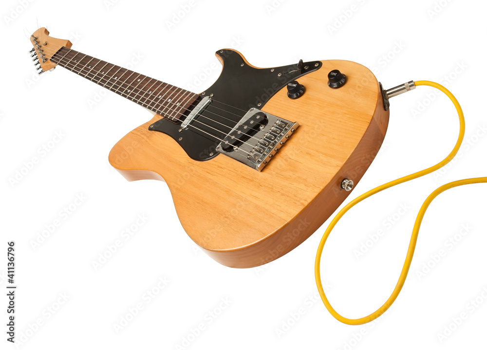 Fototapeta premium yellow electric guitar with a cable plugged