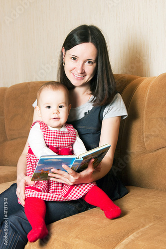 Mother reading to daughter