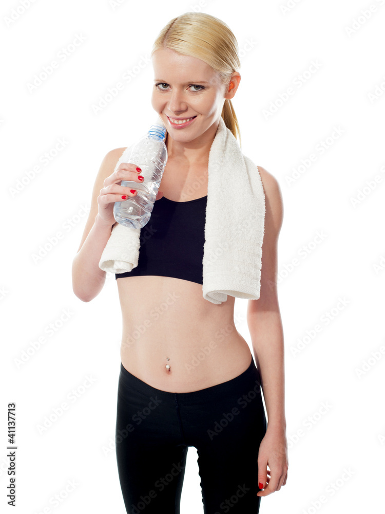 Young pretty woman in sport wear drinking water Young pretty woman in sport wear drinking water