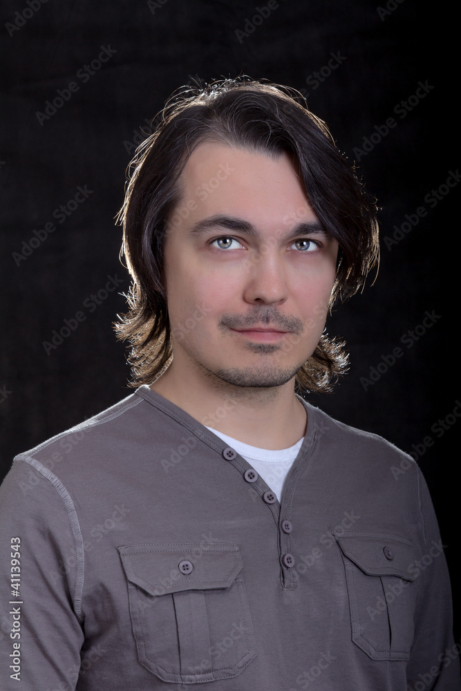 handsome young business man on gray background handsome young business man on gray background