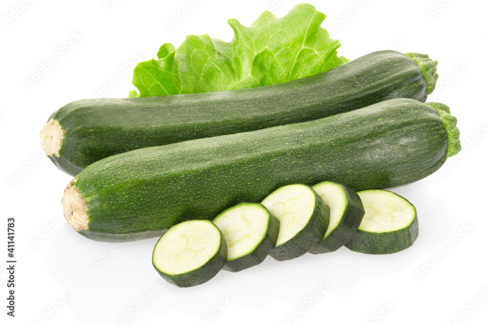 Fresh zucchini sliced on white, clipping path included Fresh zucchini sliced on white, clipping path included