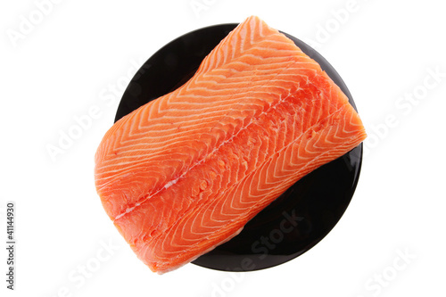 fresh raw salmon fillet on black