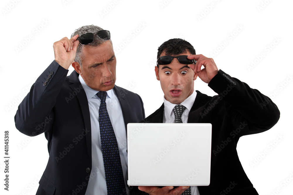 Two businessmen with shocked expression on face Two businessmen with shocked expression on face