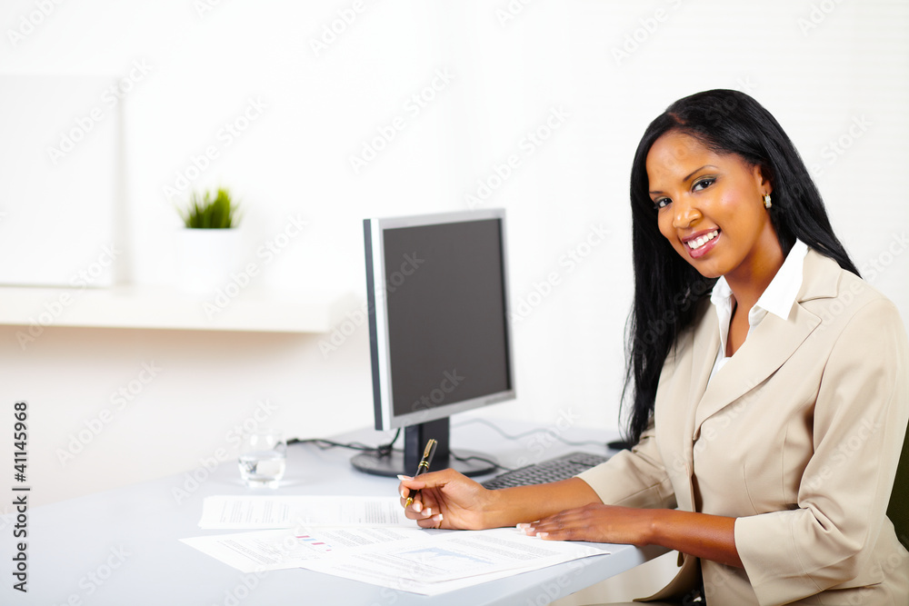 Professional woman working on documents Professional woman working on documents