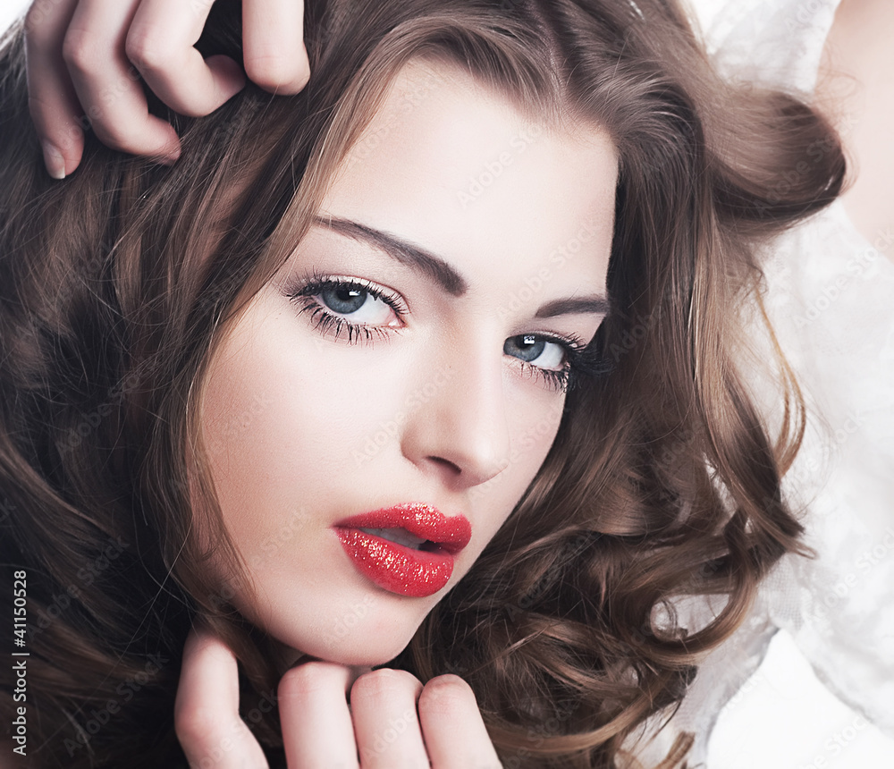 Fototapeta premium Closeup beautiful brunette woman face with sexy red lips
