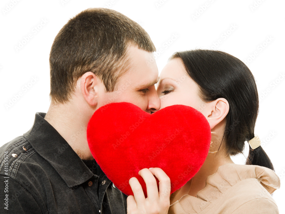 Man and woman kissing with a heart.