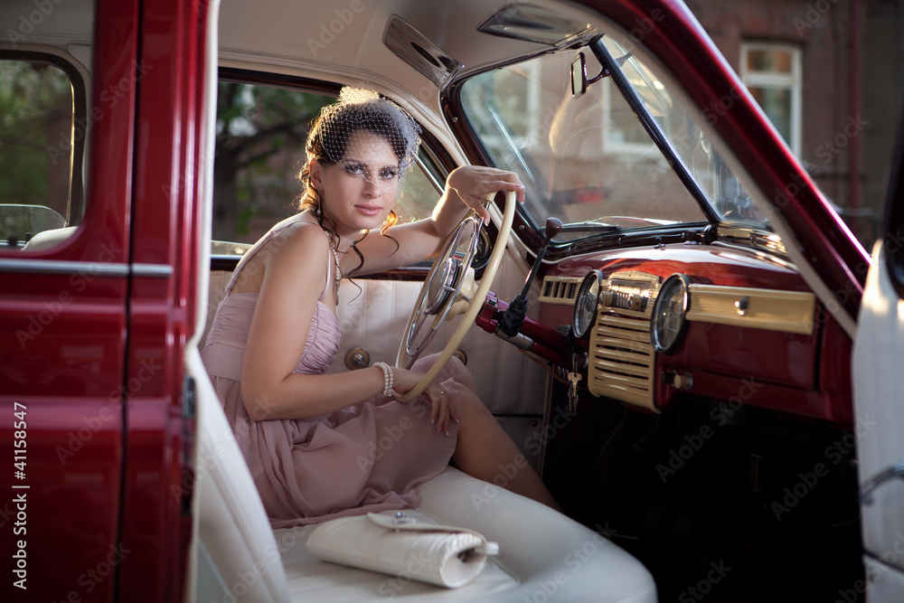 Woman in the vintage car Stock Photo | Adobe Stock