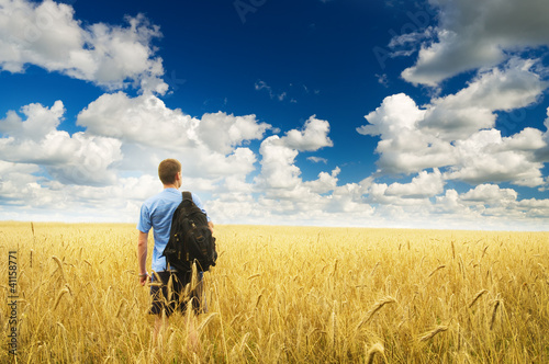 Man in yellow wheat meadow.