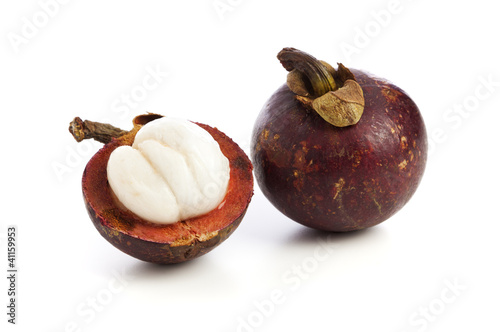 Whole and half Mangosteen Fruit isolated