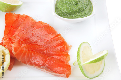 green sauce and salmon with lemon photo