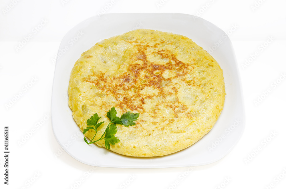 Slices of Spanish omelet or tortilla de patatas on a white plate