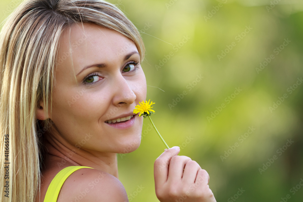 young attractive woman with flower outdoors young attractive woman with flower outdoors