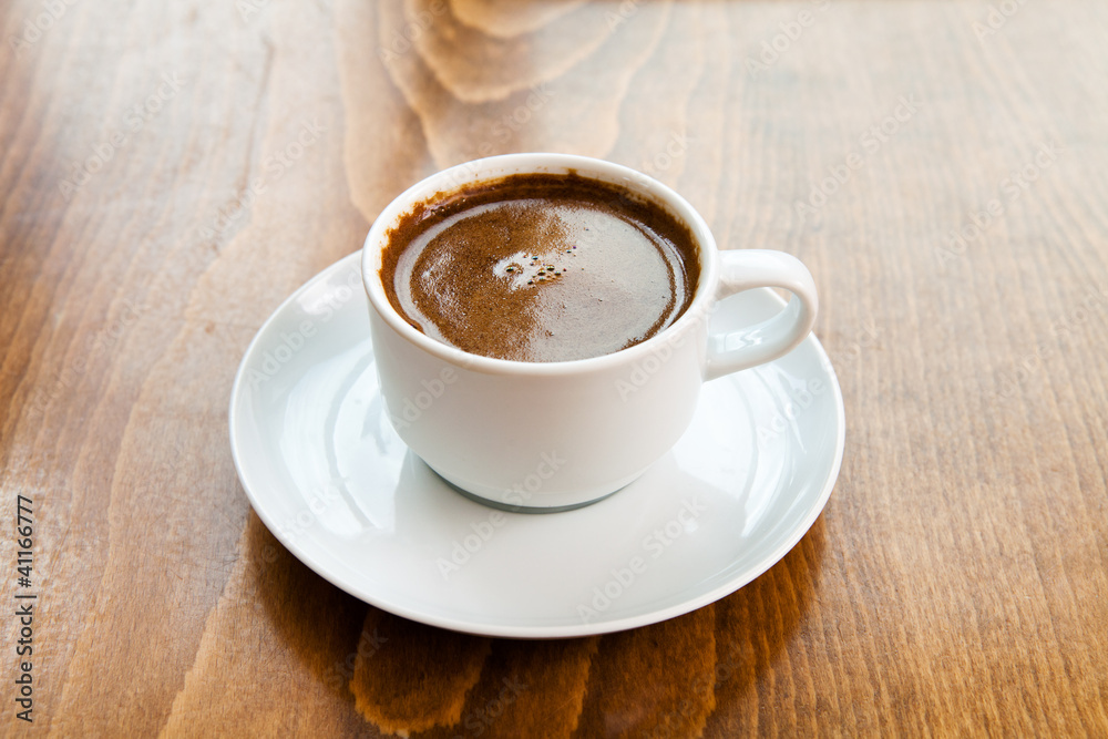 Greek turkish coffee served in a white cup Greek turkish coffee served in a white cup