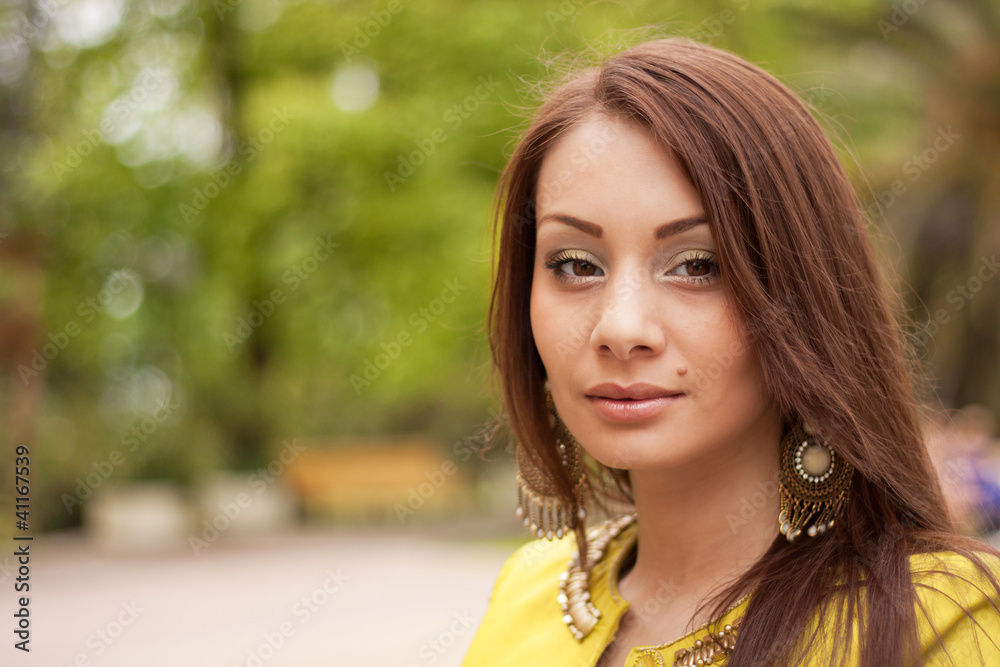 Portrait of a beautiful woman in the background bokeh