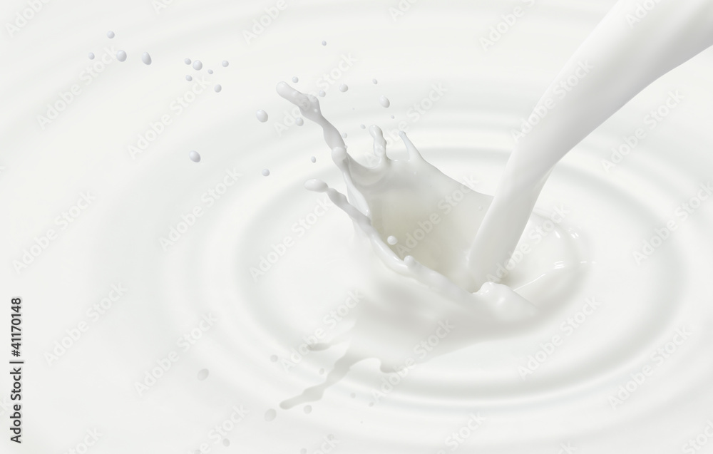 pouring milk or white liquid created ripple and splash pouring milk or white liquid created ripple and splash