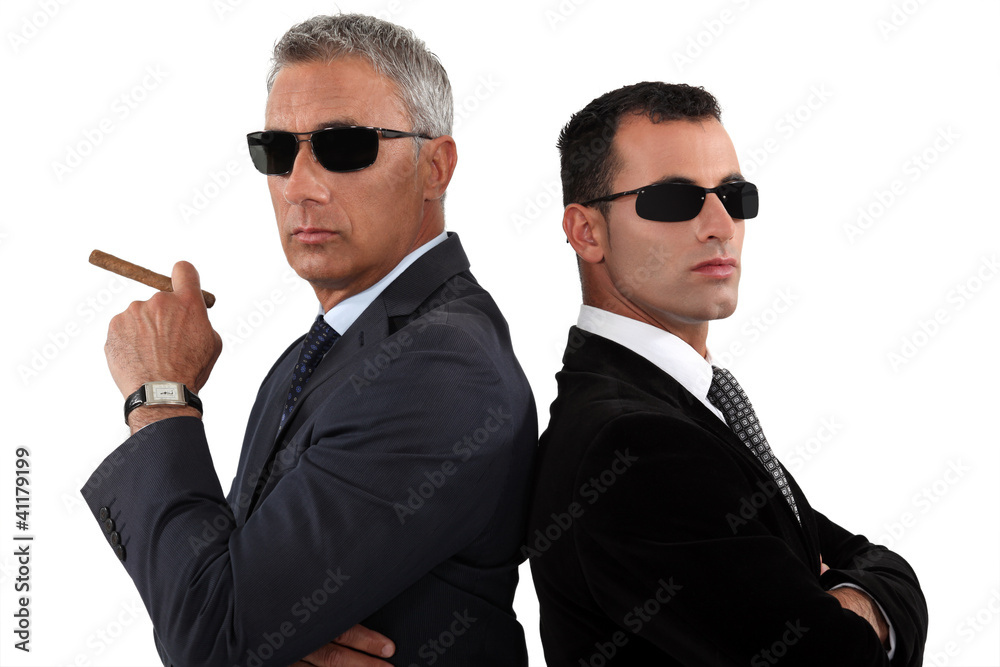 Powerful businessmen in sunglasses
